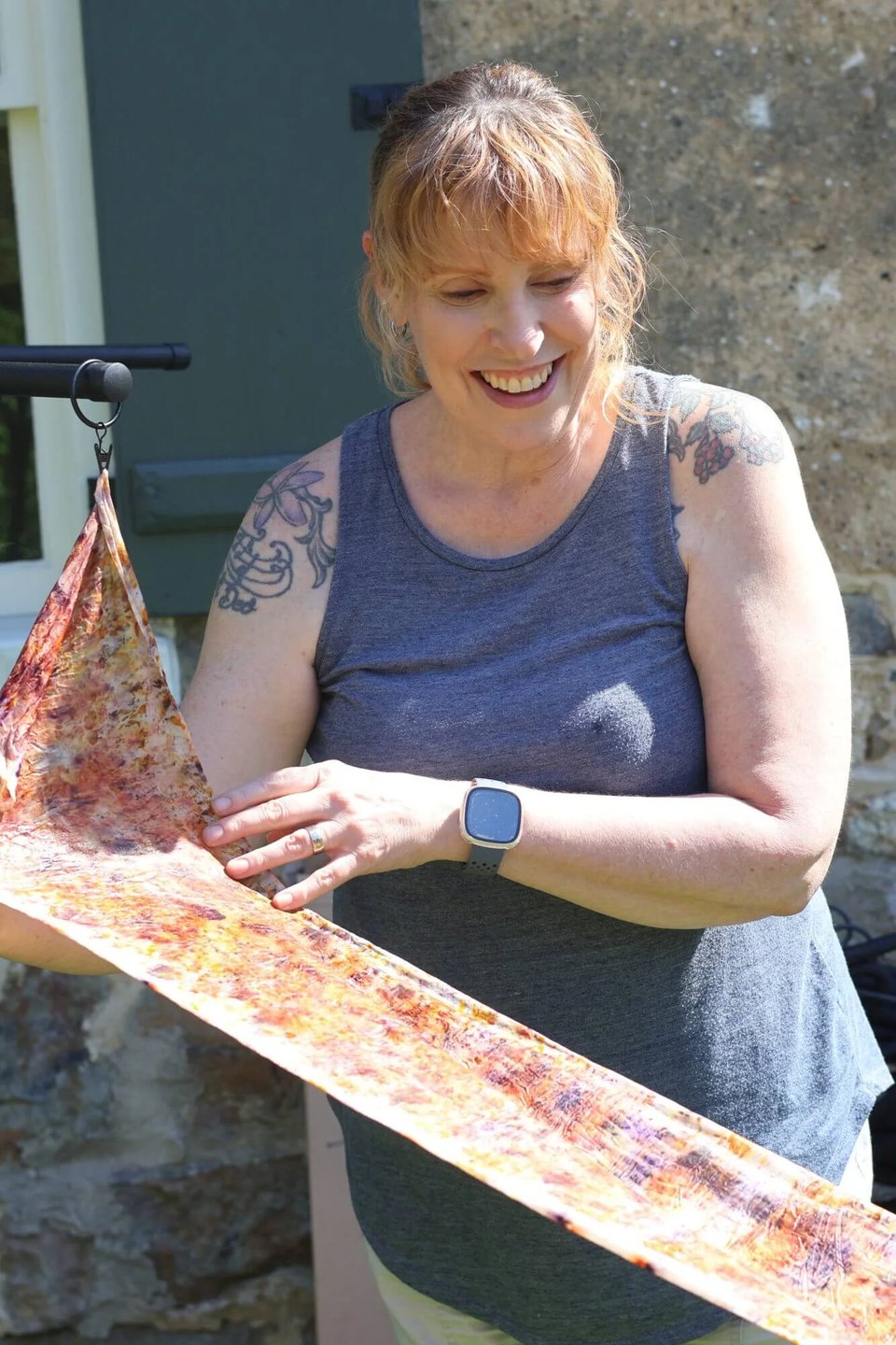 A natural dyeing class participant showing their scarf at a craft getaway in Bethlehem, PA