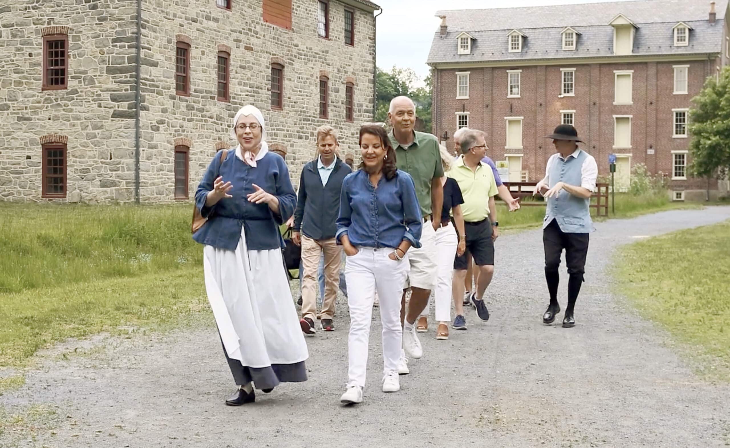 Guided walking tour passes through Colonial Industrial Quarter in Historic Bethlehem.