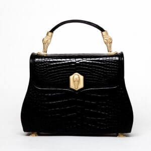 A small black handbag with gold clip